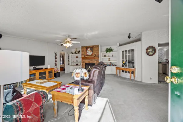 a living room with furniture and flat screen tv