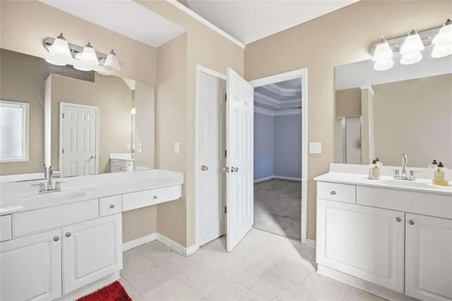 a spacious bathroom with a double vanity sink mirror and