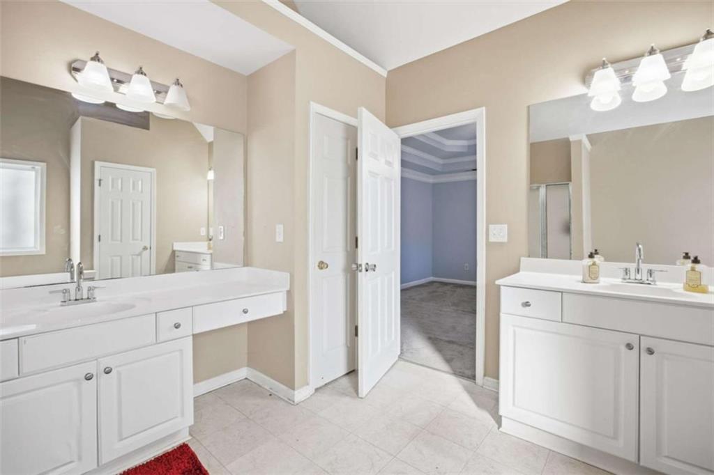 44 Creekside Way Hiram, GA 30141 - Photo 23 of 31 a spacious bathroom with a double vanity sink mirror and