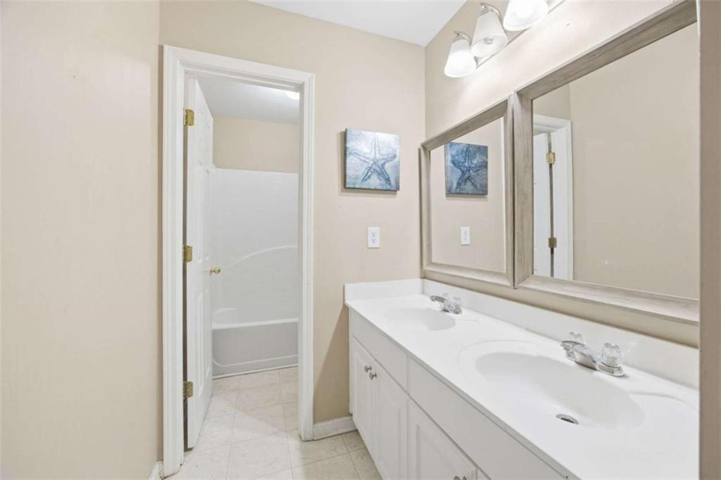 44 Creekside Way Hiram, GA 30141 - Photo 27 of 31 a bathroom with a double vanity sink mirror and double