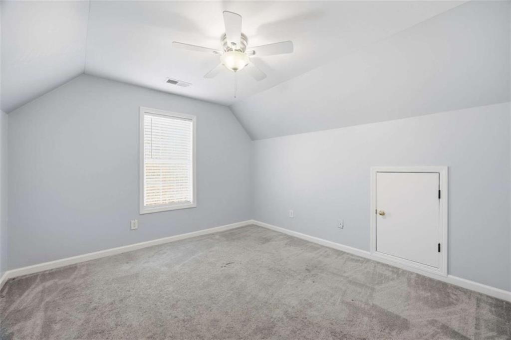 44 Creekside Way Hiram, GA 30141 - Photo 28 of 31 an empty room with a window and a fan