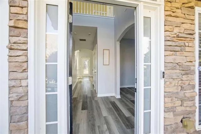 a bathroom with a glass shower door and a bathtub