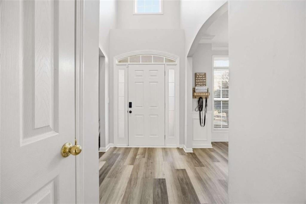 44 Creekside Way Hiram, GA 30141 - Photo 6 of 31 a view of a hallway with wooden floor and closet