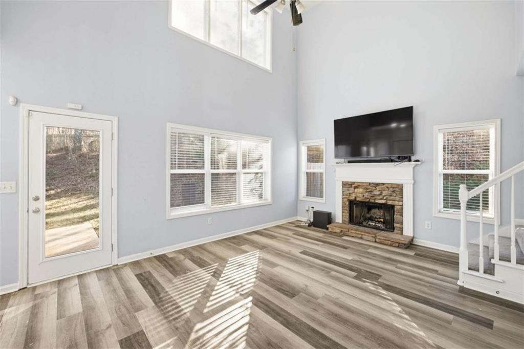 44 Creekside Way Hiram, GA 30141 - Photo 10 of 31 a view of a livingroom with a fireplace and a window