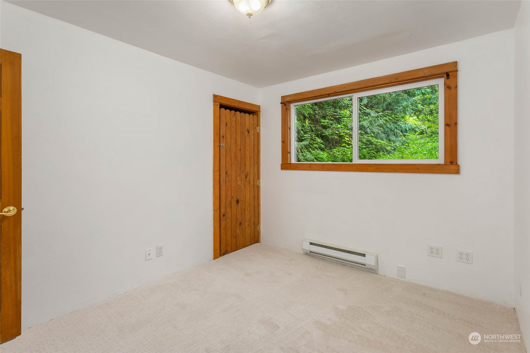 1321 Southwest Lake Roesiger Road Snohomish, WA 98290 - Photo 25 of 38 an empty room with a window