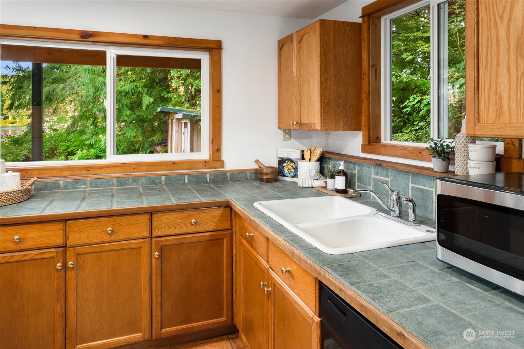 1321 Southwest Lake Roesiger Road Snohomish, WA 98290 - Photo 9 of 38 a kitchen with granite countertop a sink and a window
