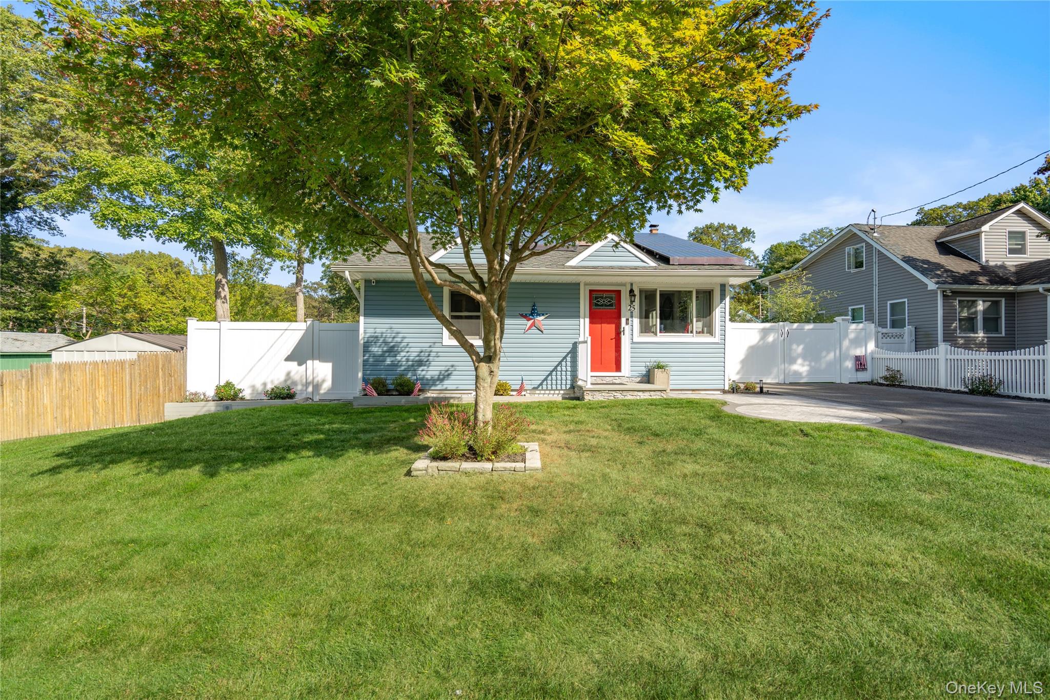 a front view of a house with garden