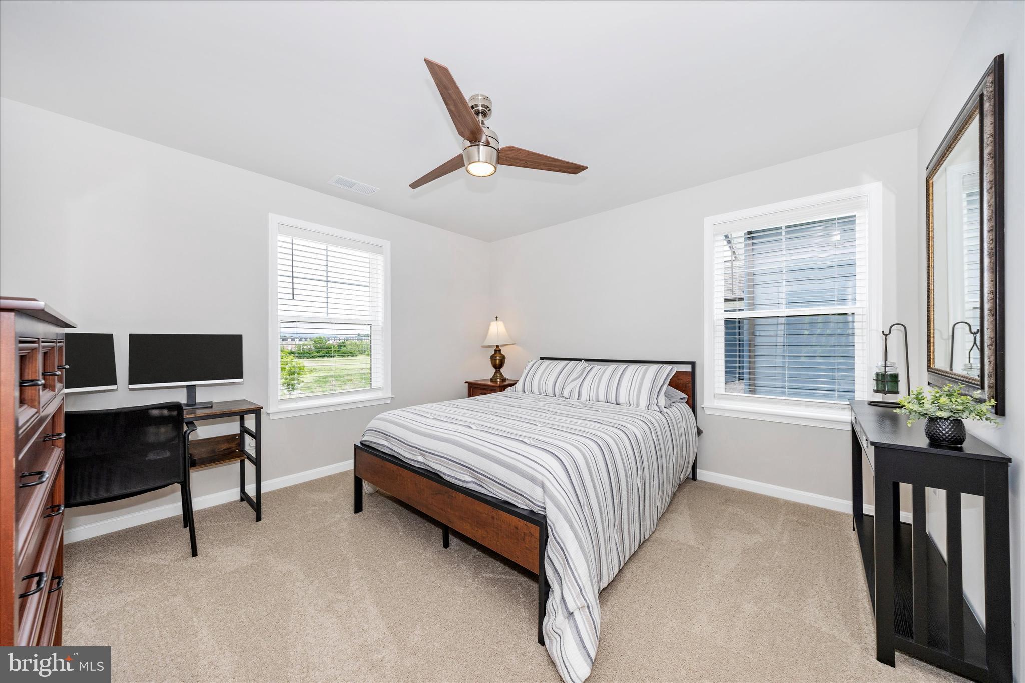 700 Bond Street Frederick, MD 21701 - Photo 24 of 49 a bed room with a bed and a desk