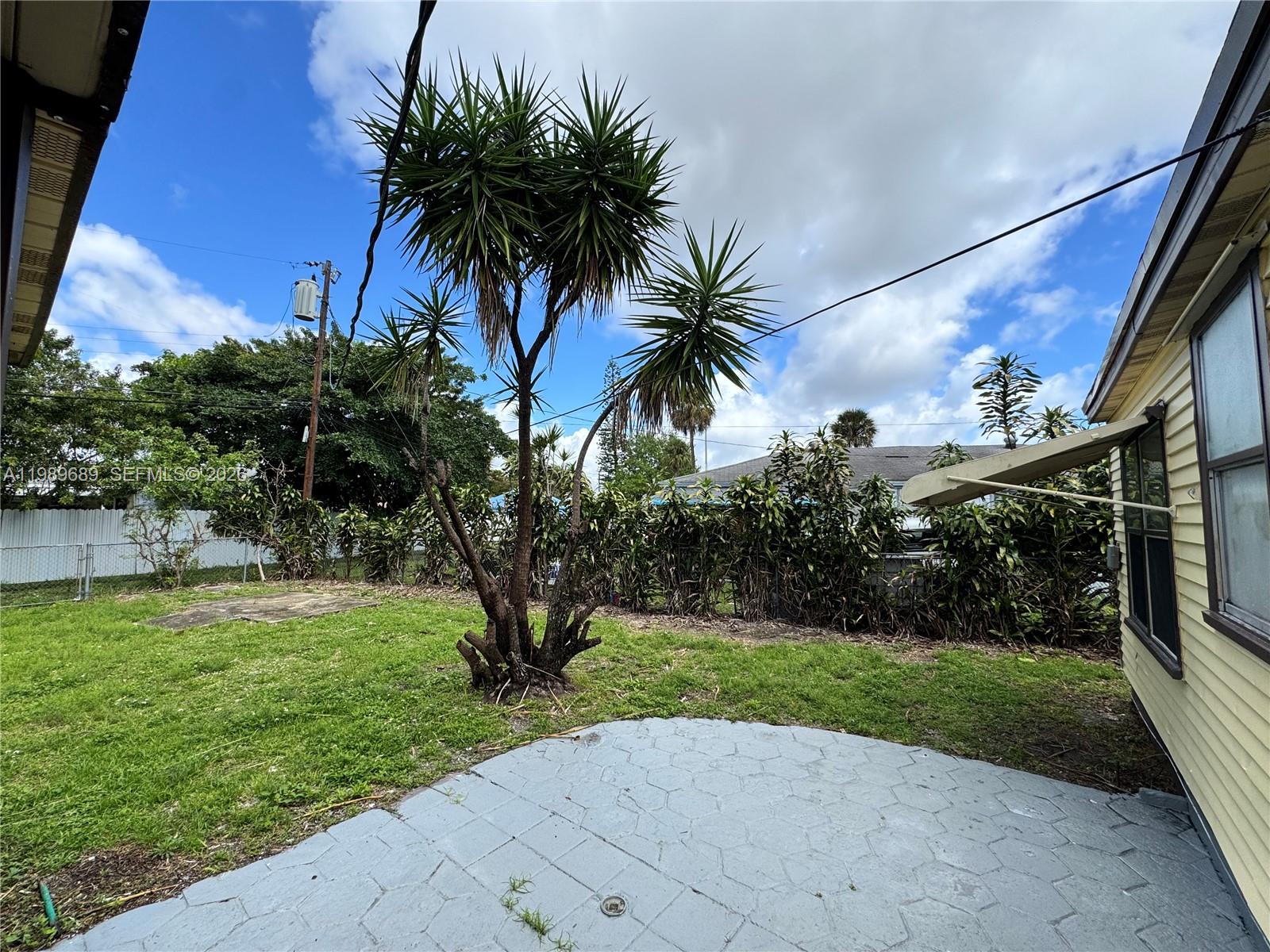 1441 Northeast 134th Road, Unit 2 North Miami, FL 33161 - Photo 14 of 16 a view of a yard and entertaining space