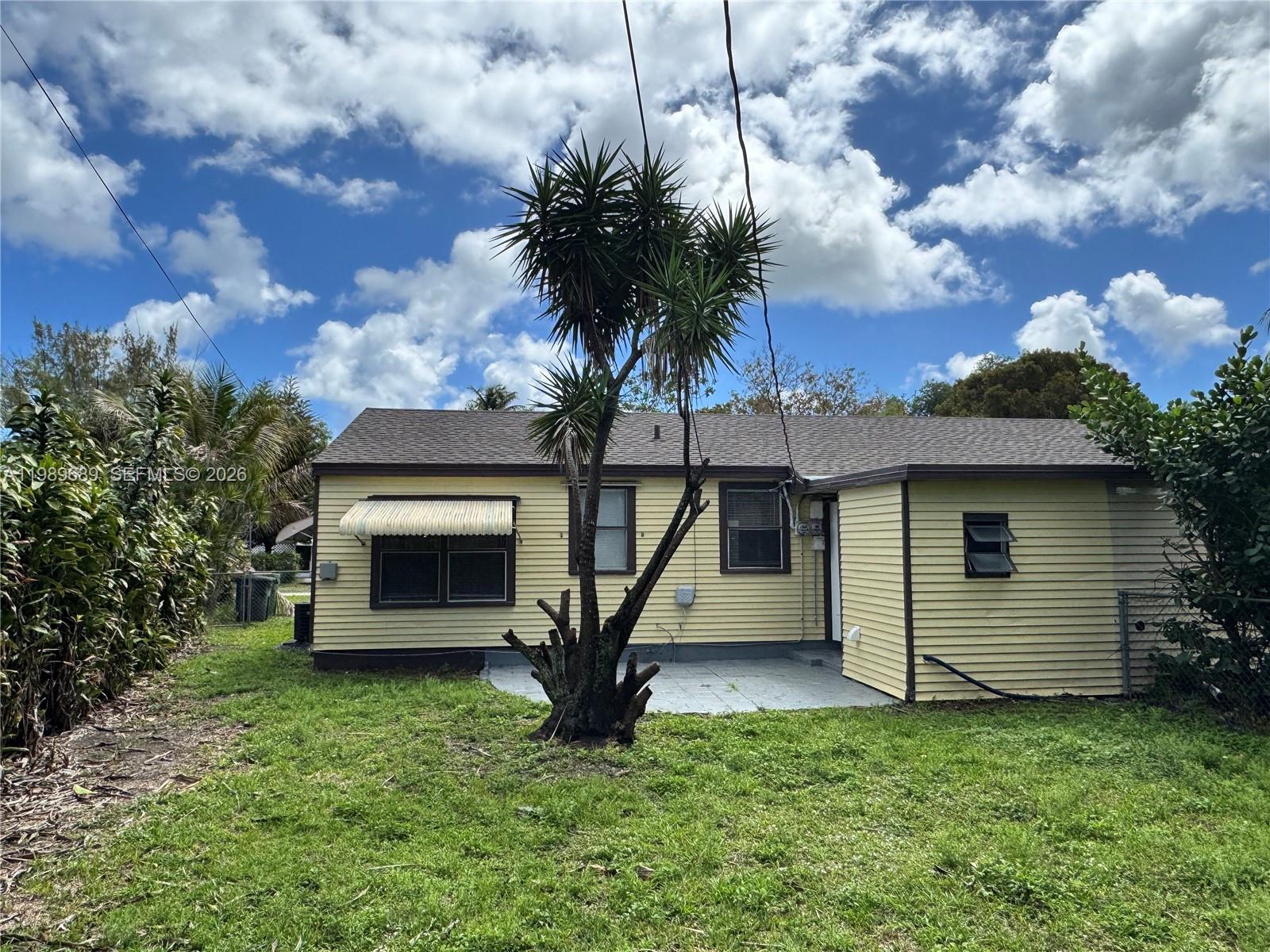 1441 Northeast 134th Road, Unit 2 North Miami, FL 33161 - Photo 15 of 16 a view of a house with a backyard