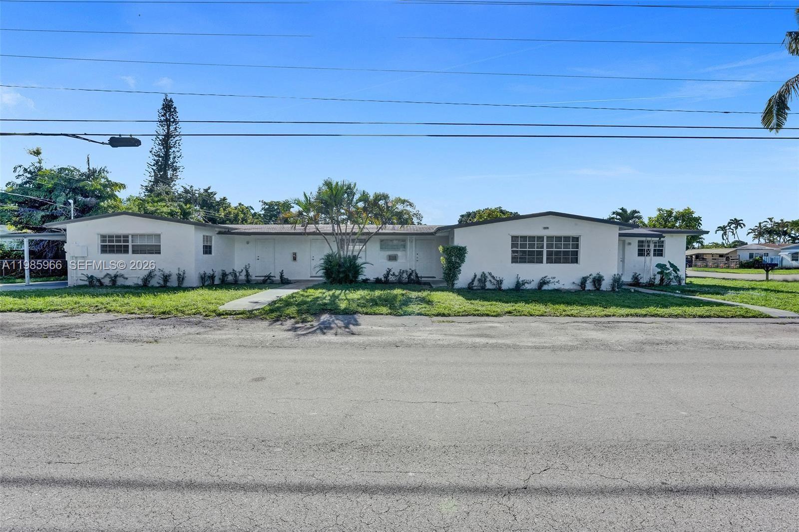 5657 Grant Street, Unit 4 Hollywood, FL 33021 - Photo 12 of 13 a house view with a outdoor space