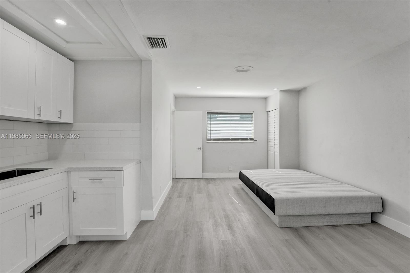 5657 Grant Street, Unit 4 Hollywood, FL 33021 - Photo 4 of 13 a room with a bed and a window