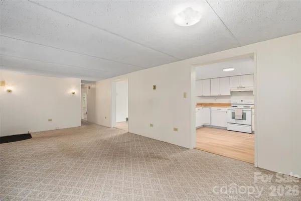 a view of a kitchen with a sink and cabinets