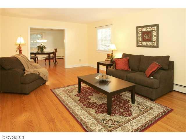 5116 Sylvan Road Richmond, VA 23225 - Photo 2 of 12 Living Room - Large, Bright LIVING ROOM, located to the right of the entryway, with beautiful hardwood floors, leads into the dining room. This floor plan has great, circular flow.