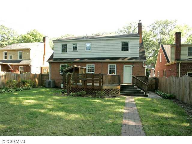 5116 Sylvan Road Richmond, VA 23225 - Photo 11 of 12 Exterior Back - Large DECK with built-in bench, attached shed, and access to the kitchen through the laundry room is the perfect setting for outdoor entertaining!