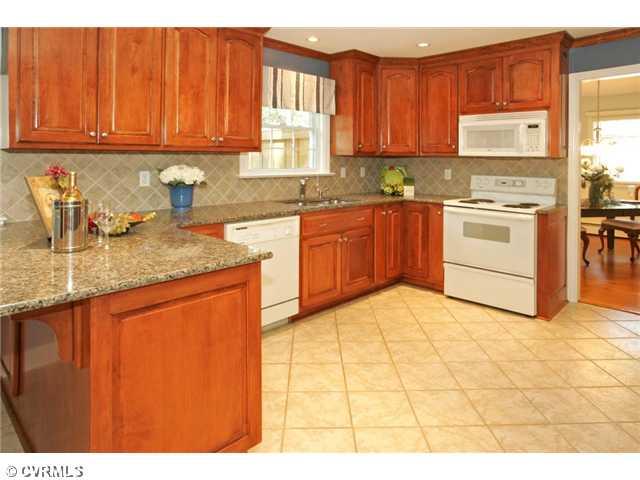 5116 Sylvan Road Richmond, VA 23225 - Photo 4 of 12 Kitchen - Sophisticated KITCHEN, renovated from top to bottom with recessed lights, crown molding and new cabinets, granite counters and ceramic tile backsplash and floor.