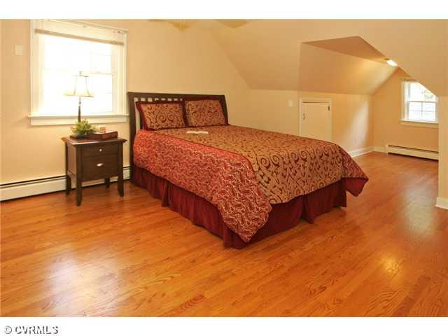 5116 Sylvan Road Richmond, VA 23225 - Photo 7 of 12 Master Bedroom - MASTER BEDROOM on second floor features gleaming hardwood floors, a versatile alcove, and en suite renovated bathroom with large walk-in closet.