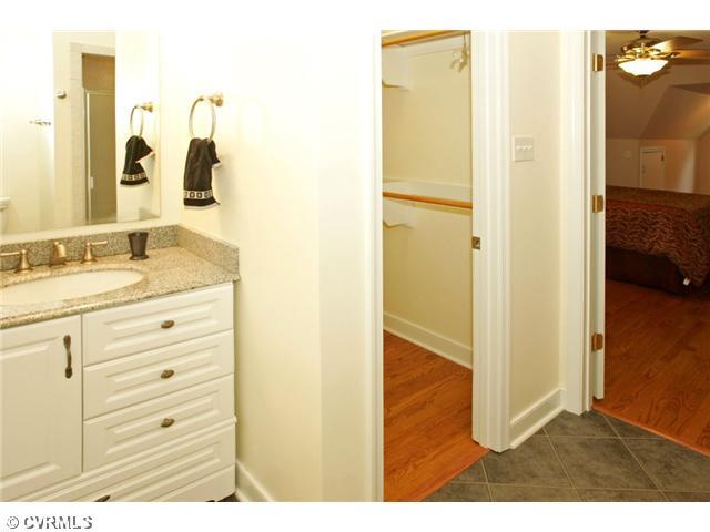 5116 Sylvan Road Richmond, VA 23225 - Photo 8 of 12 Master Bath - En suite MASTER BATH with large closet, renovated ceramic shower with glass door, tile floor, and updated oversized vanity with granite.