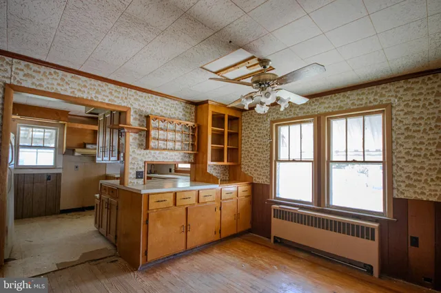 a view of a kitchen with a sink washer and dryer