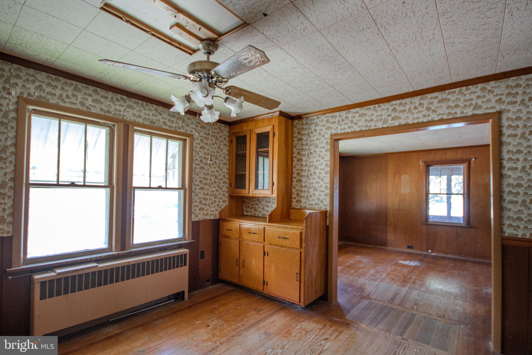 605 4th Street Sharptown, MD 21861 - Photo 12 of 38 a view of a livingroom with a window and chandelier