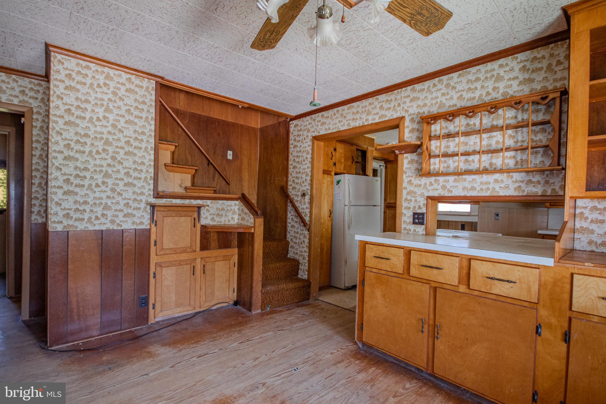 605 4th Street Sharptown, MD 21861 - Photo 13 of 38 a kitchen with stainless steel appliances granite countertop a refrigerator and a sink