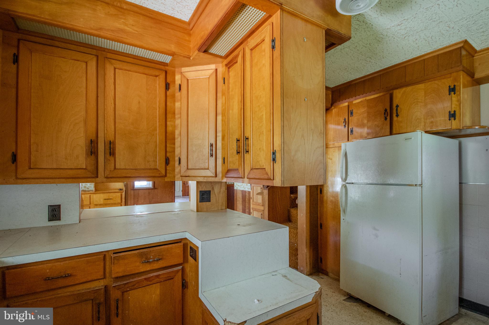 605 4th Street Sharptown, MD 21861 - Photo 16 of 38 a kitchen with stainless steel appliances a refrigerator and a sink