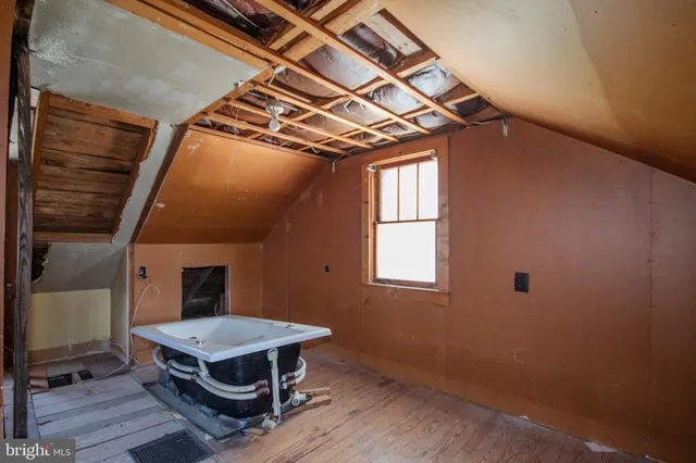 a kitchen with windows and refrigerator