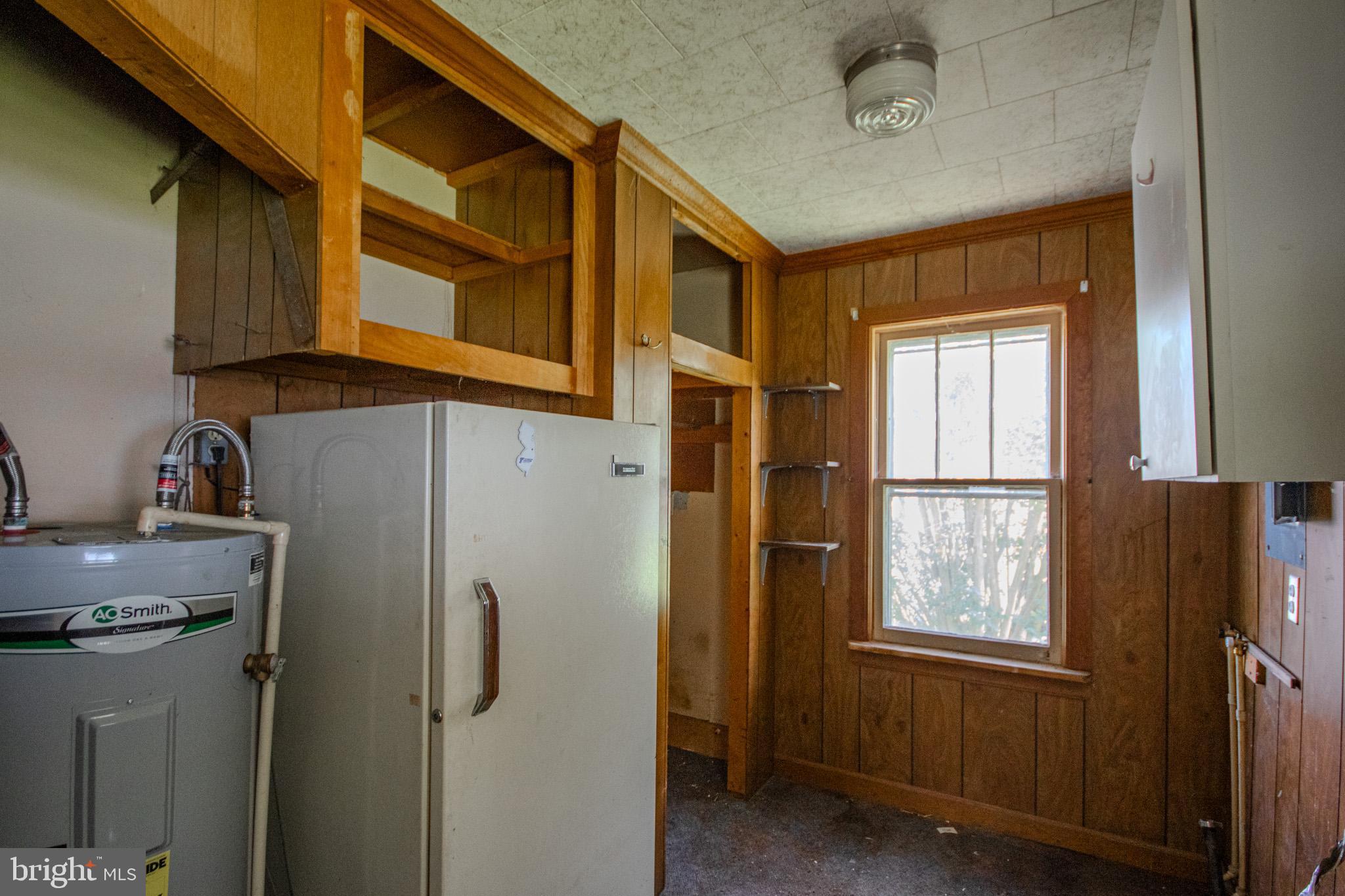 605 4th Street Sharptown, MD 21861 - Photo 28 of 38 a kitchen with windows and refrigerator
