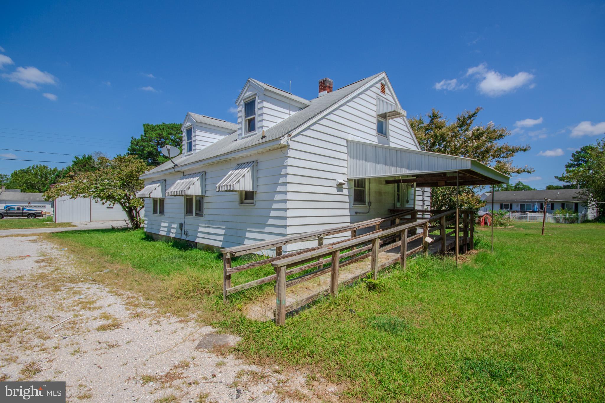 605 4th Street Sharptown, MD 21861 - Photo 34 of 38 a view of house with backyard and outdoor seating
