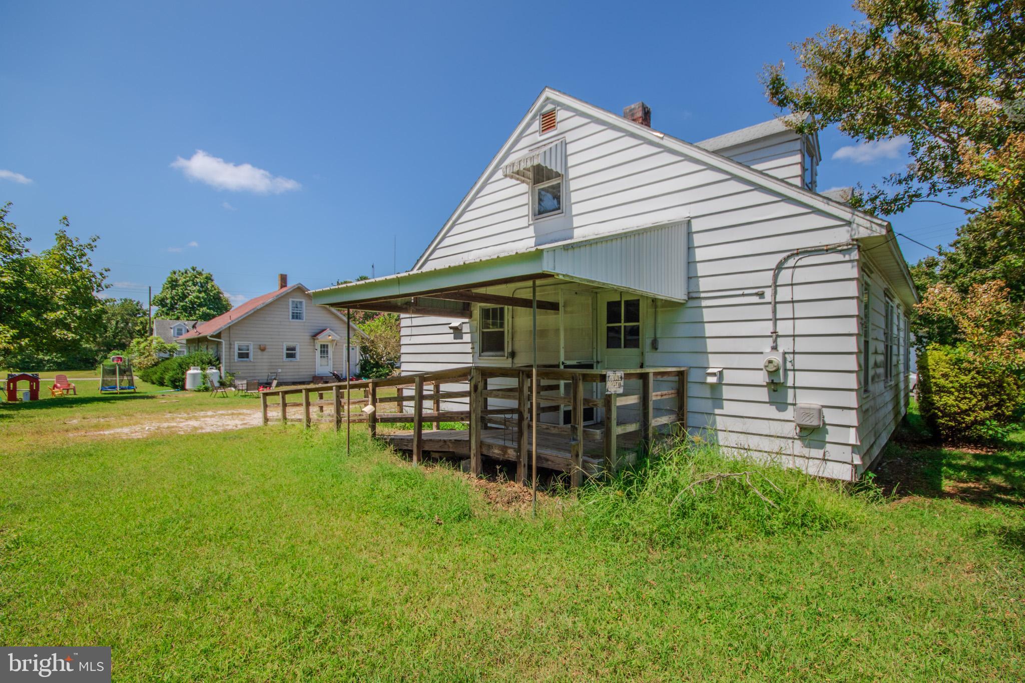 605 4th Street Sharptown, MD 21861 - Photo 36 of 38 a view of a house with a yard and sitting area