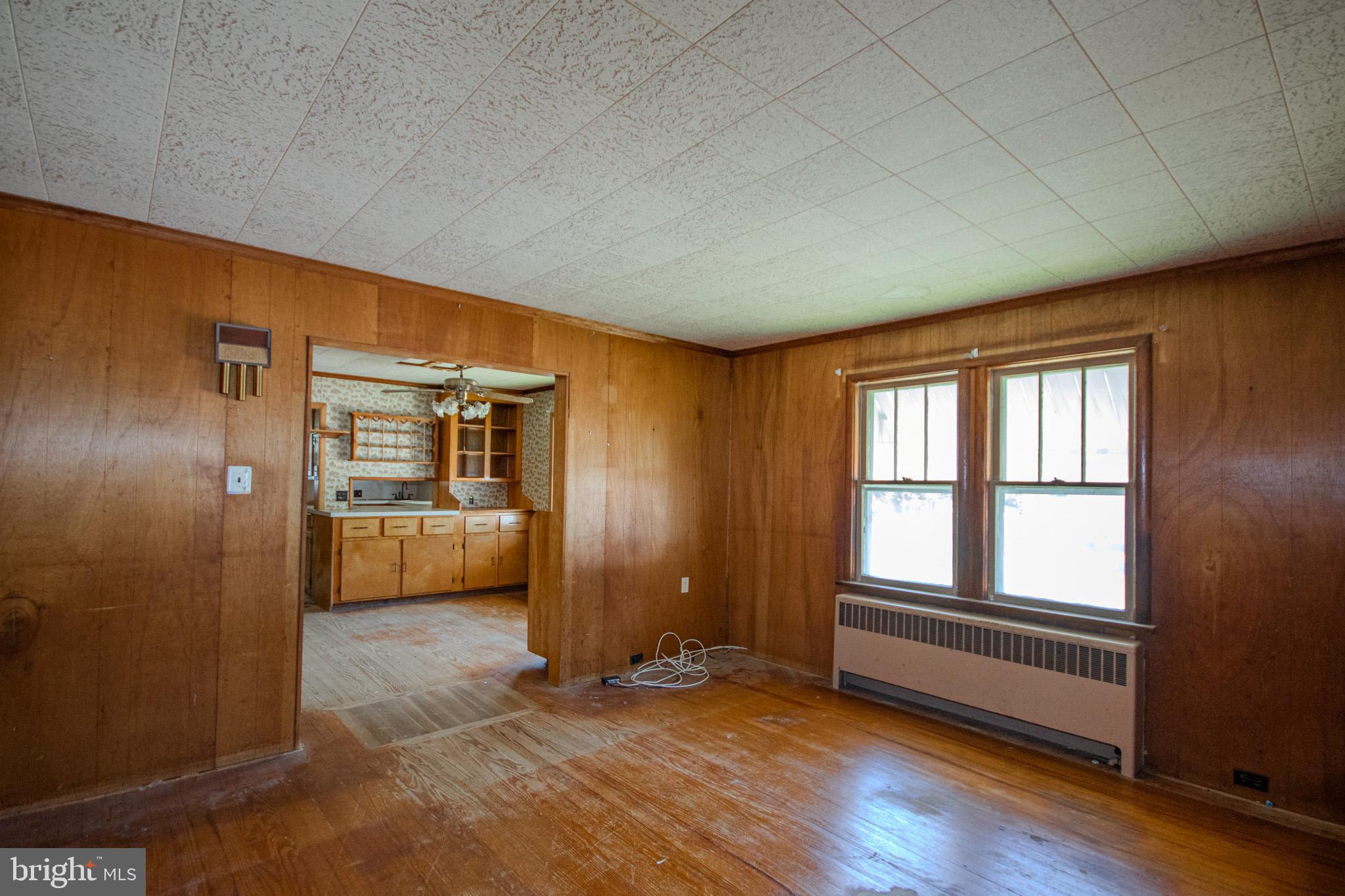 605 4th Street Sharptown, MD 21861 - Photo 8 of 38 a view of an empty room and a kitchen