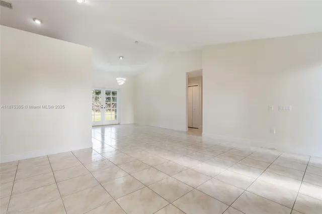 a view of an empty room and window