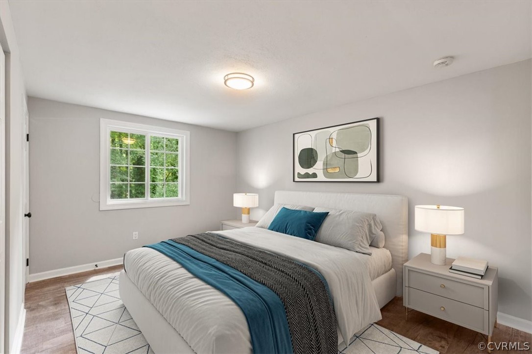 10501 White Rabbit Road Richmond, VA 23235 - Photo 22 of 49 a bedroom with a large bed and a window