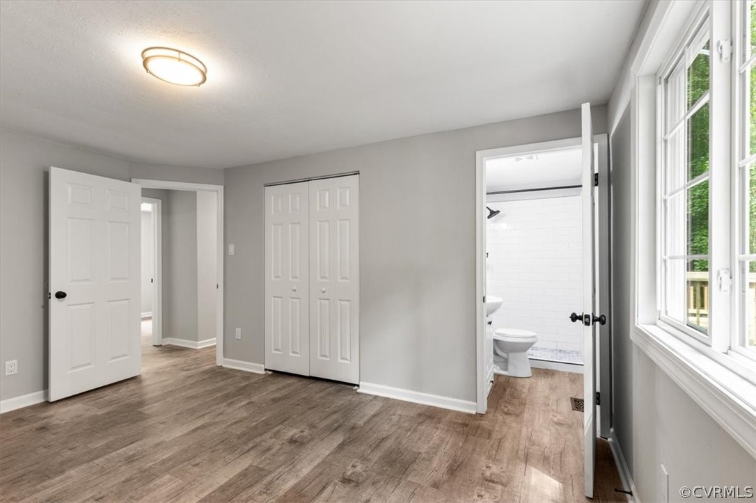 10501 White Rabbit Road Richmond, VA 23235 - Photo 26 of 49 a view of a room with wooden floor and a bathroom