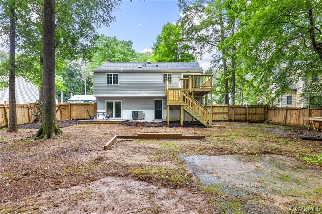 10501 White Rabbit Road Richmond, VA 23235 - Photo 44 of 49 a view of house with trees in the background
