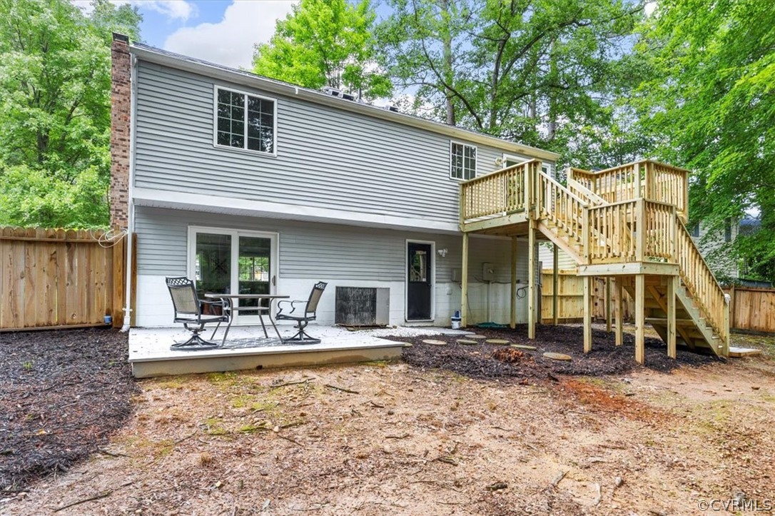 10501 White Rabbit Road Richmond, VA 23235 - Photo 45 of 49 a view of a house with backyard and sitting area