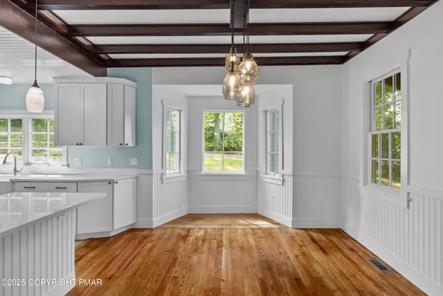 a view of balcony with wooden floor