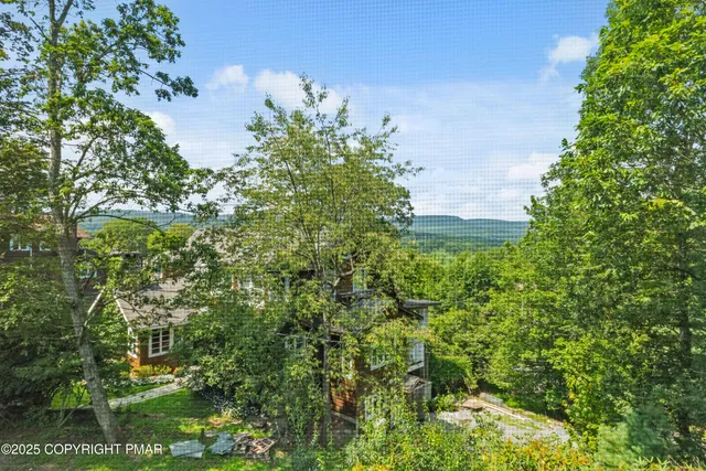 a kitchen with stainless steel appliances a stove microwave and a refrigerator
