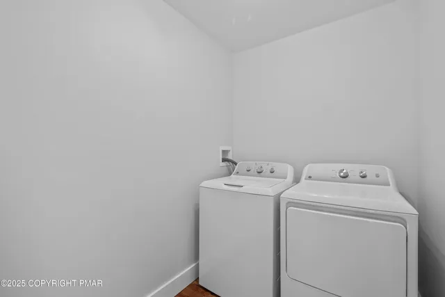 a view of a patio with table and chairs and potted plants