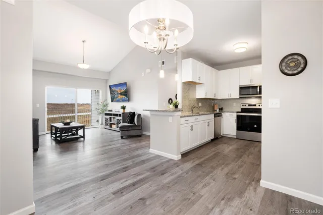 a view of kitchen with sink microwave and stove