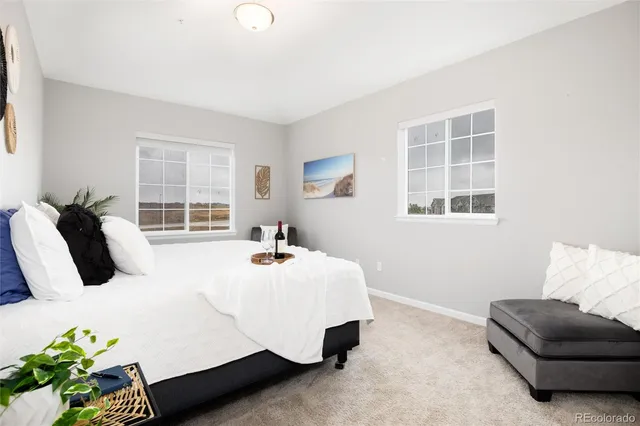 a bedroom with bed and a couch