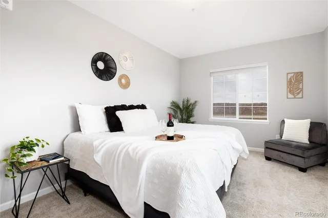 a bedroom with bed and windows