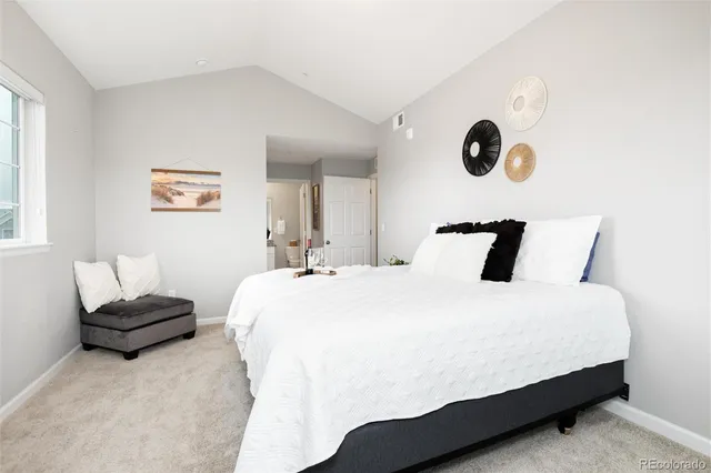 a bathroom with a granite countertop sink a mirror and a shower