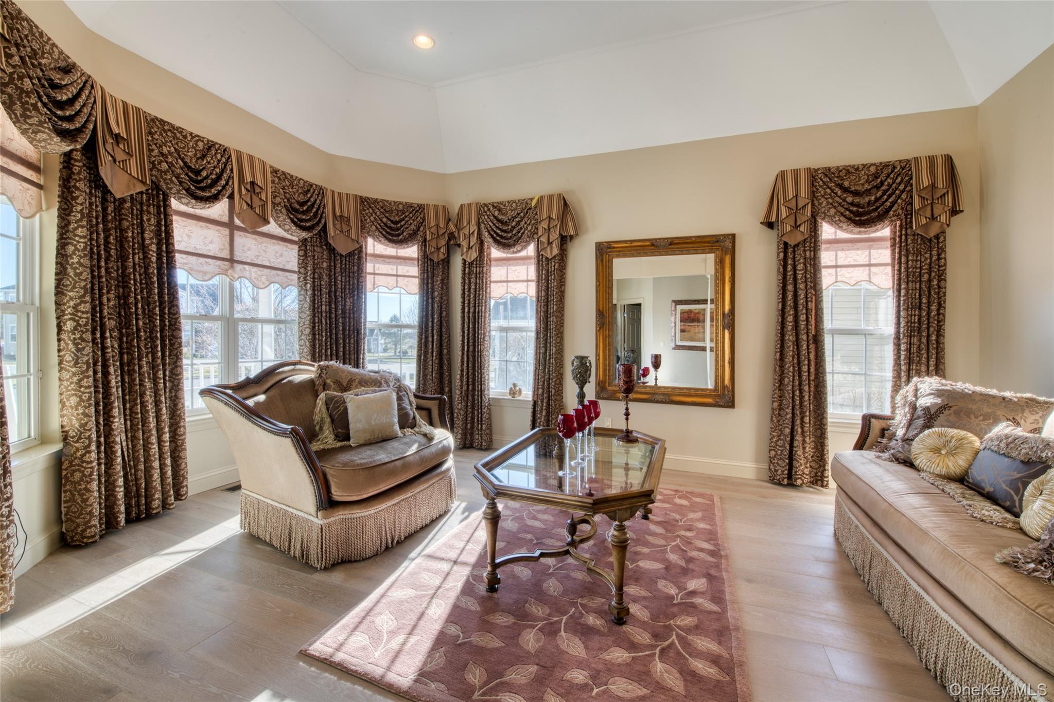 395 Stonecrop Road Riverhead, NY 11901 - Photo 12 of 40 Den featuring oak wood floors and ceiling to floor windows