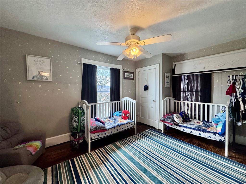 1409 Cambria Avenue Windber, PA 15963 - Photo 11 of 19 a bedroom with furniture and wooden floor