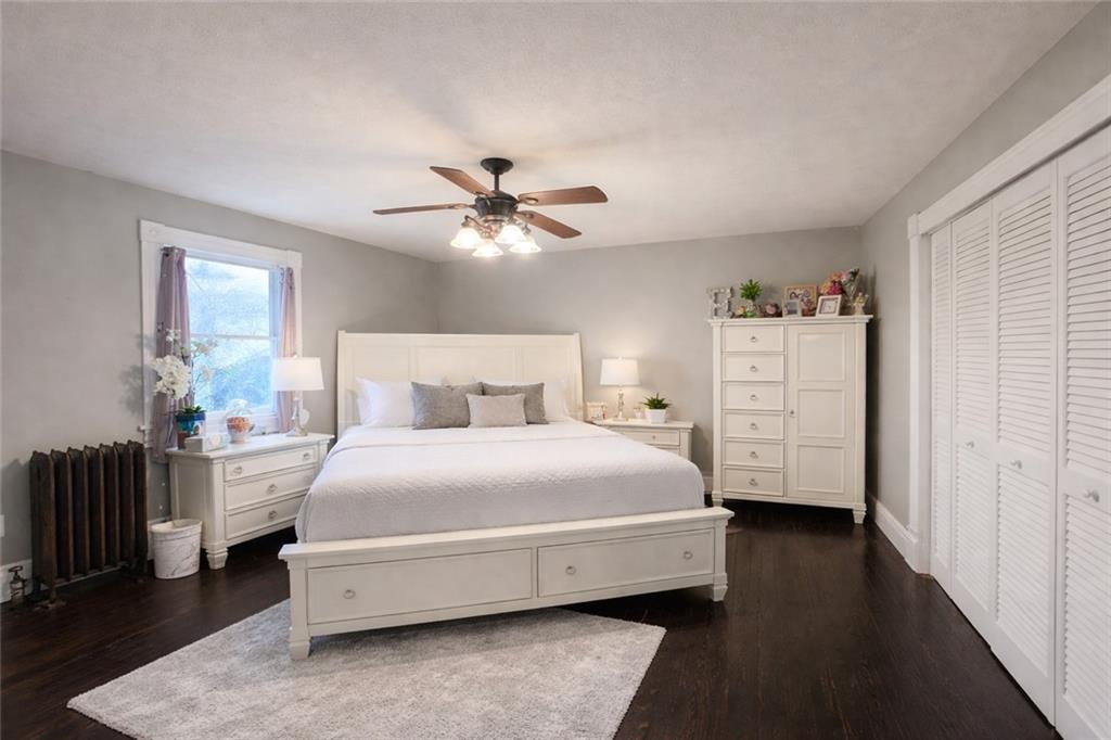 1409 Cambria Avenue Windber, PA 15963 - Photo 10 of 19 a spacious bedroom with a bed and a chandelier