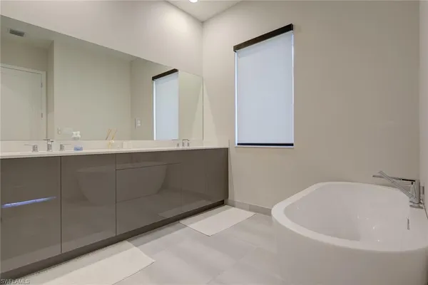 a bathroom with a bathtub and a sink