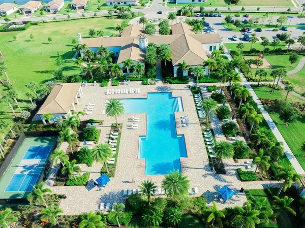 an aerial view of residential houses with outdoor space and street view