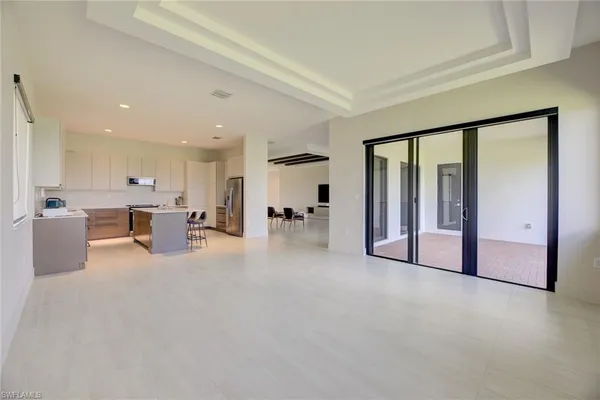 a view of a kitchen with furniture and a large window