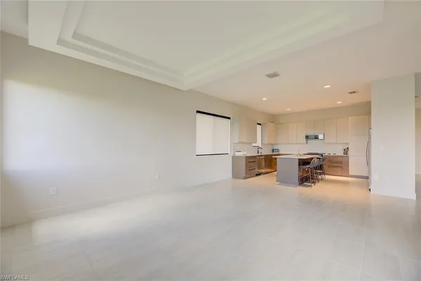 a view of a kitchen with furniture and window